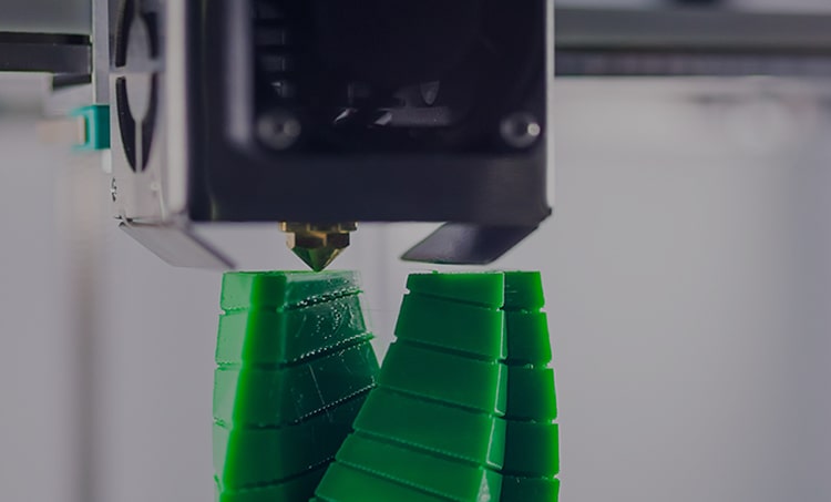 Closeup of a 3D printer printing plastic