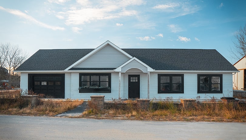 The front of a grey 3D printed house