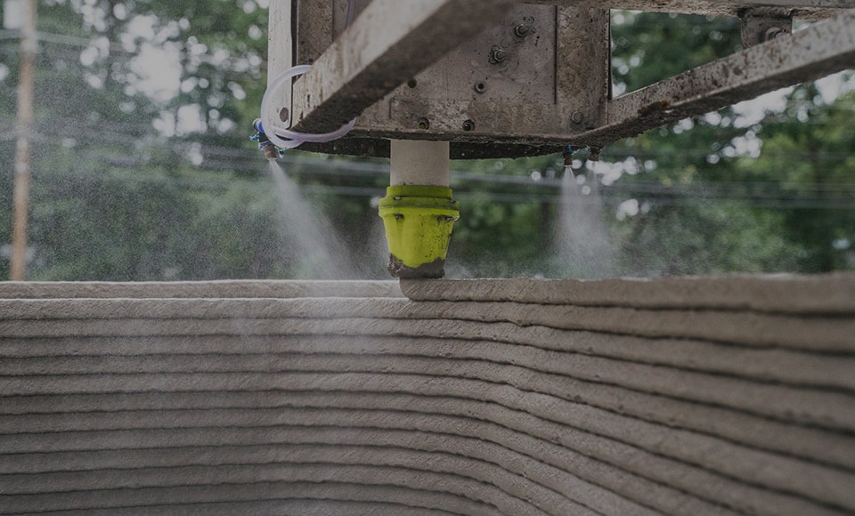 3D printer printing a concrete wall